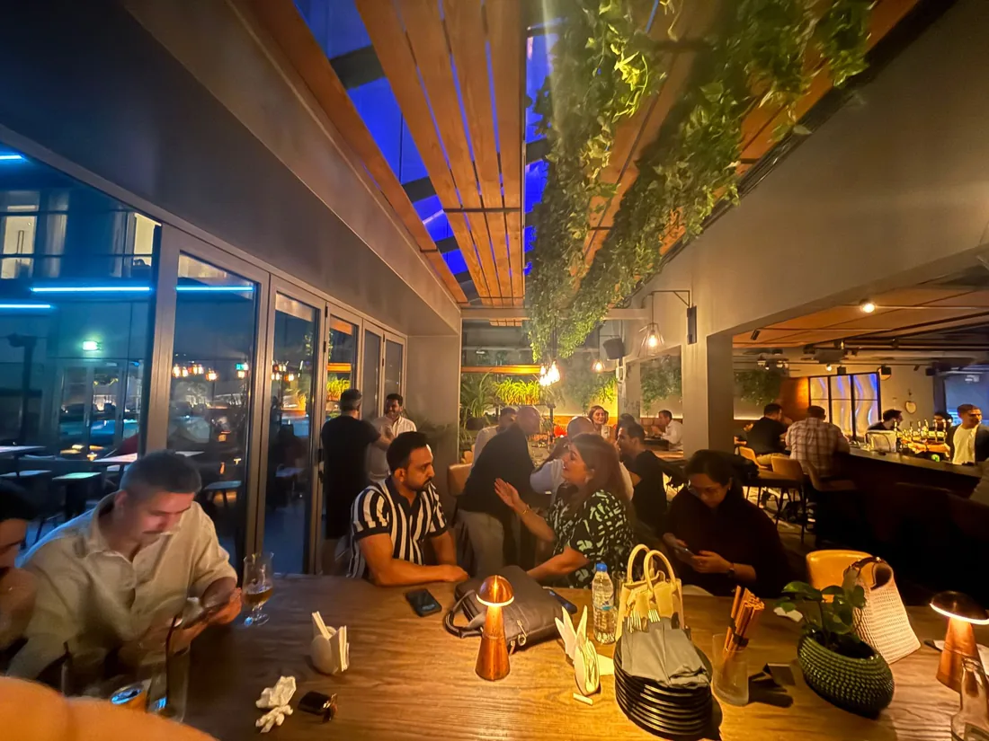 A long table of members mid-evening